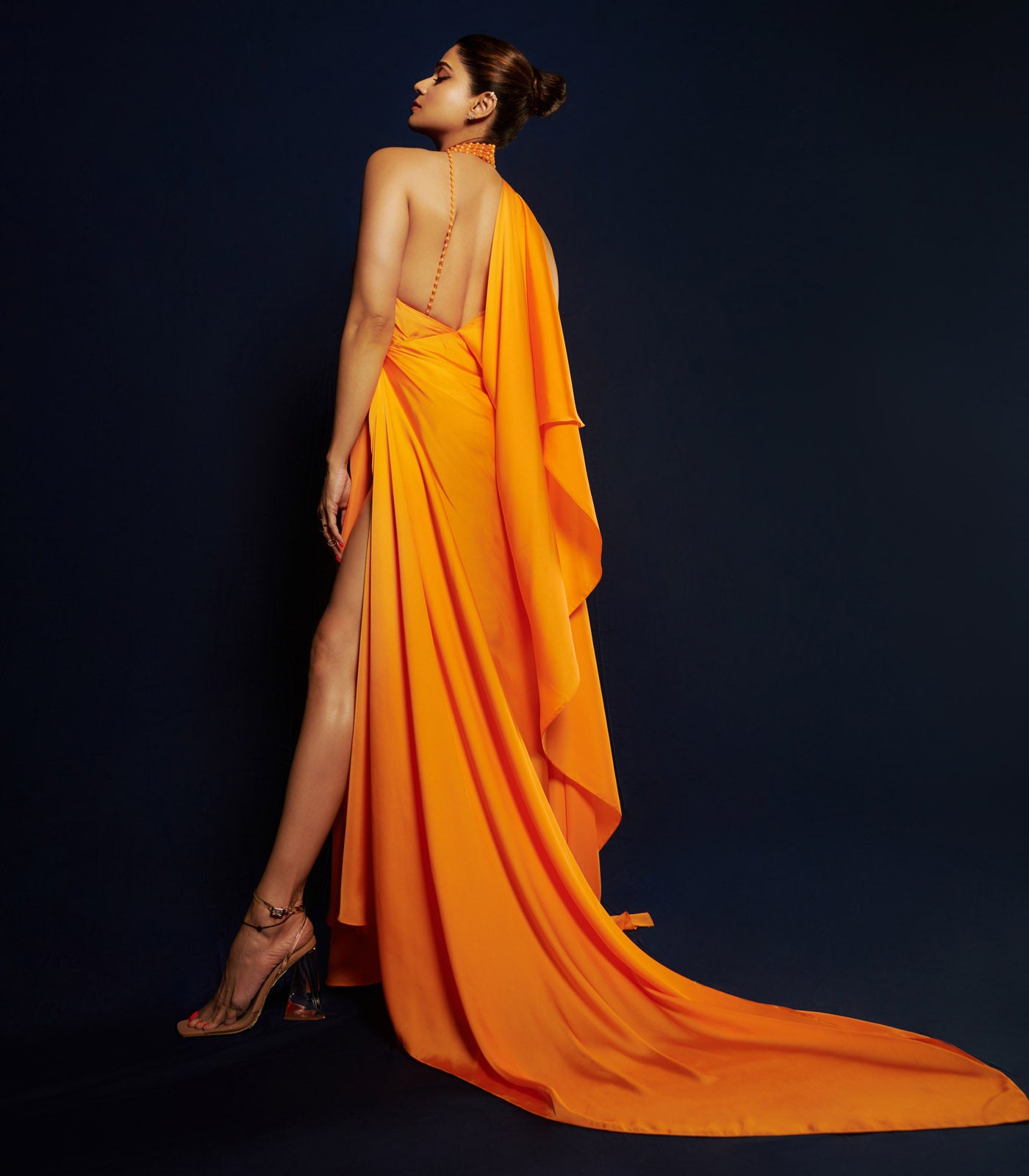 Shamita Shetty spotted in our orange halter neck draped gown